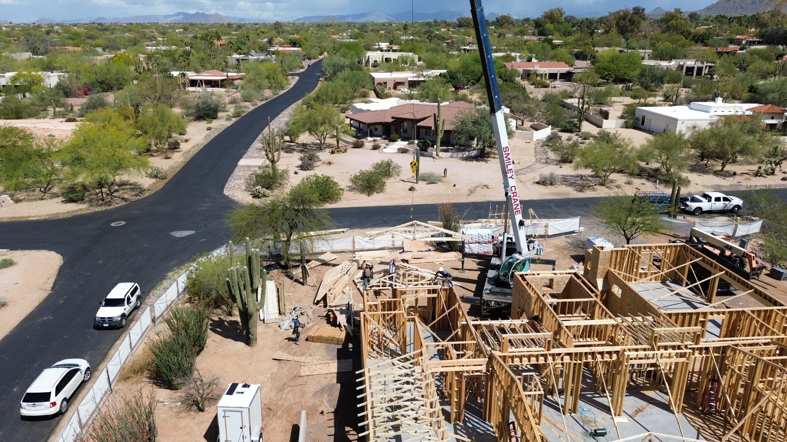 Aerial view of roof framing on custom home construction project in Arizona